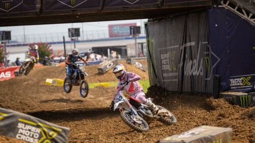 SMX 2024 Rd 02 Texas Hunter Lawrence leads Eli Tomac through tunnel turn.JPG